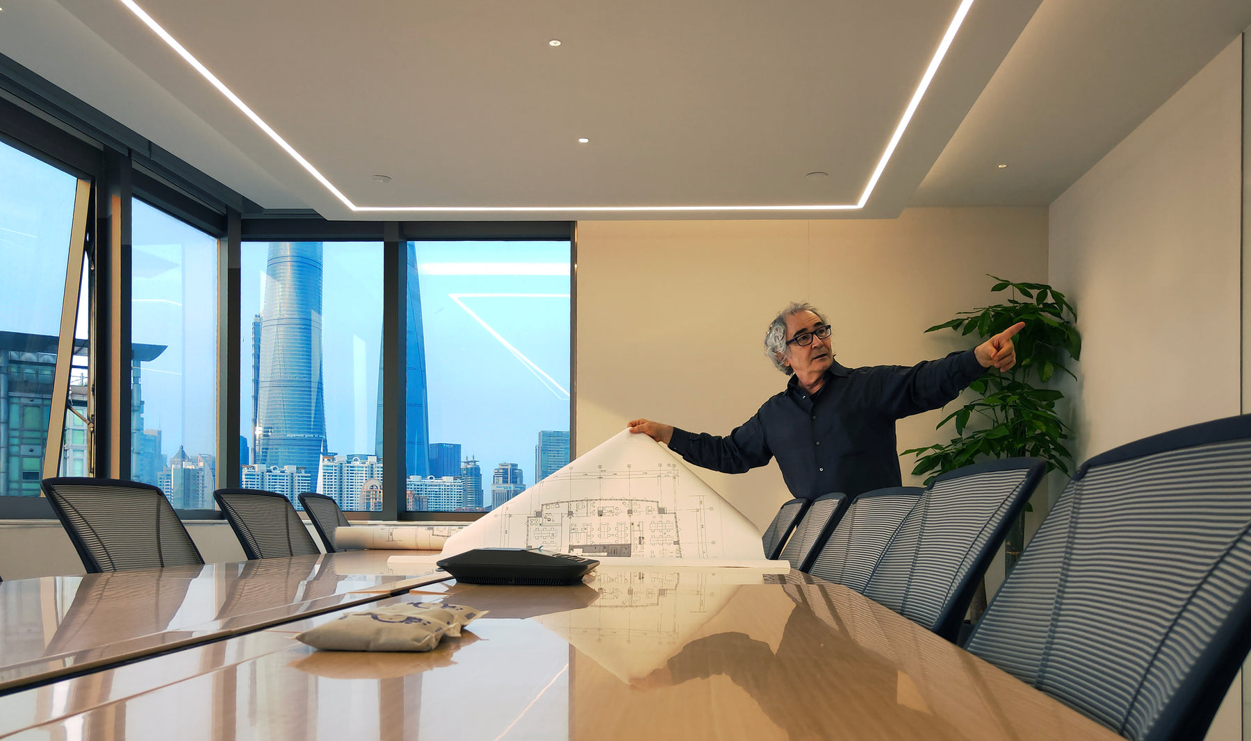 Cerj Lalonde reviewing floor plans on a commercial project in Shanghai