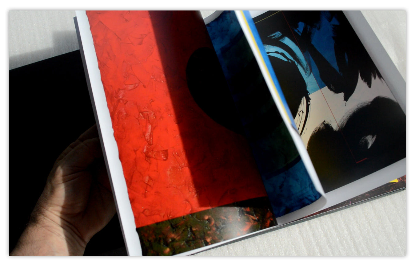 The Multiple Gazes II open to vivid red and blue artworks