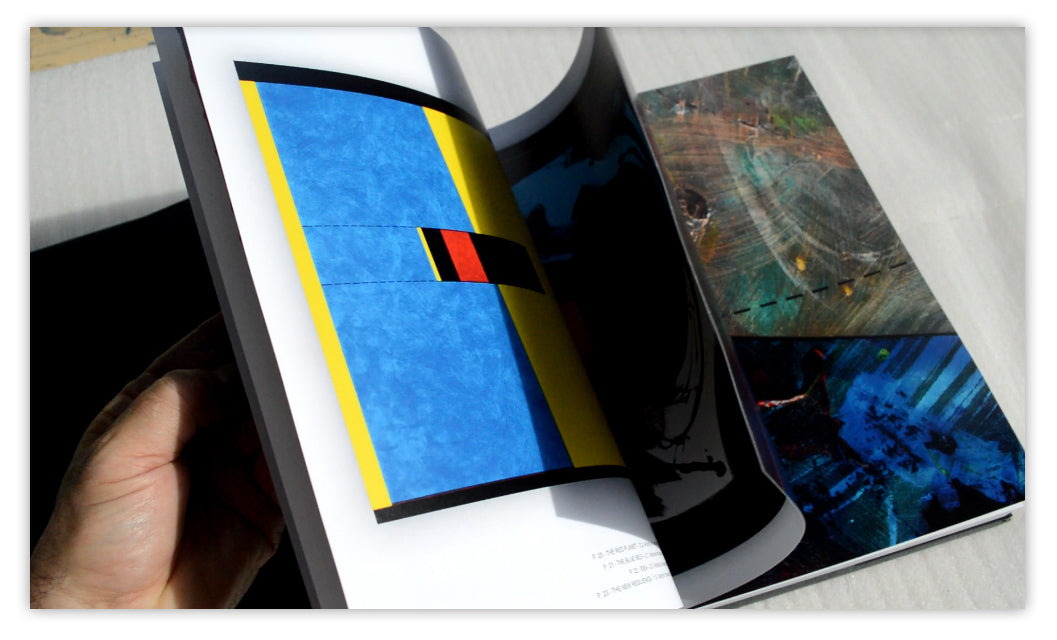 The Multiple Gazes II open to geometric blue and yellow works